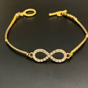 Gold tone Infinity Bracelet with Crystals & gold tone toggle clasp NWOT